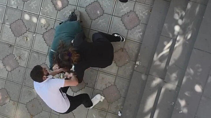 Kocasıyla ilişkisi olduğunu iddia ettiği kadına cadde ortasında saldırdı