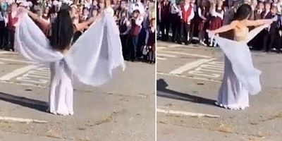 Kadın öğretmen okul açılışında dansöz kıyafetiyle göbek attı