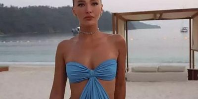 Melisa Döngel cesur elbisesiyle sahile damga vurdu